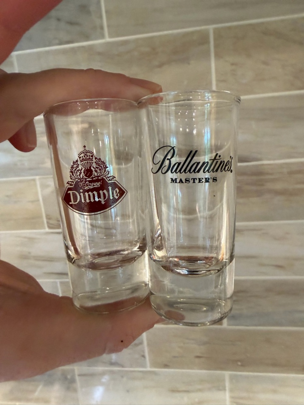 Two vintage shot glasses- Dimple and Ballantine’s